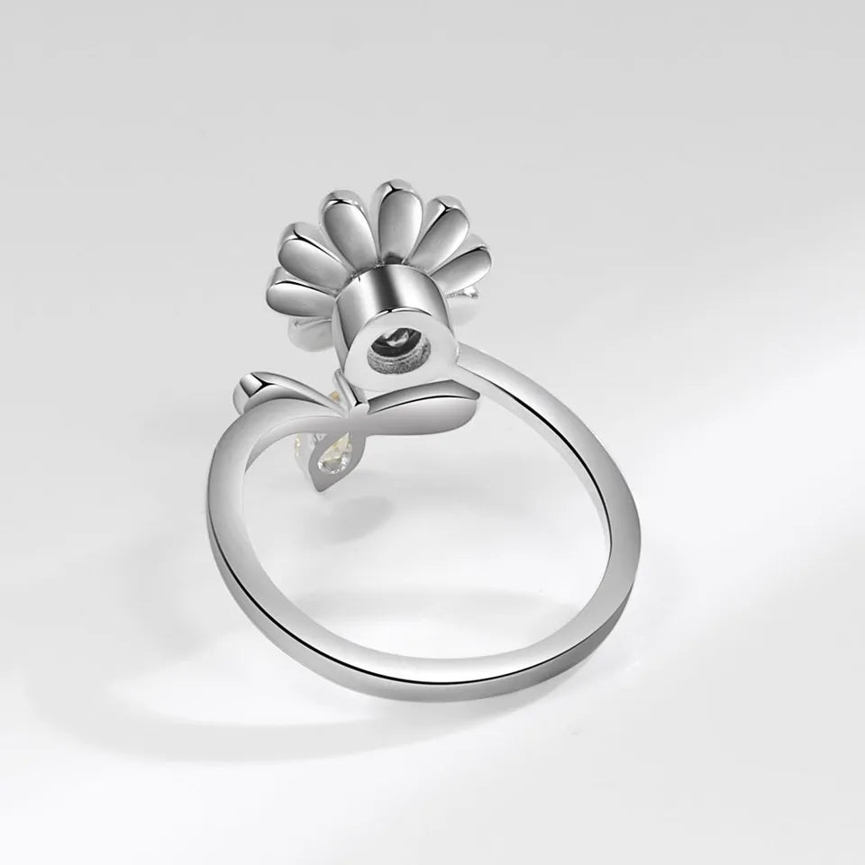 Anillo mariposa y flor azul