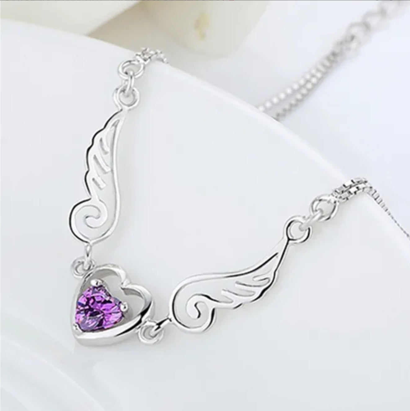 Colgante alas corazón morado plata 925