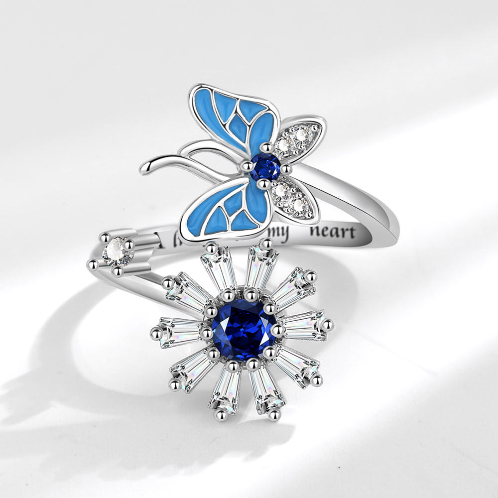 Anillo mariposa y flor azul