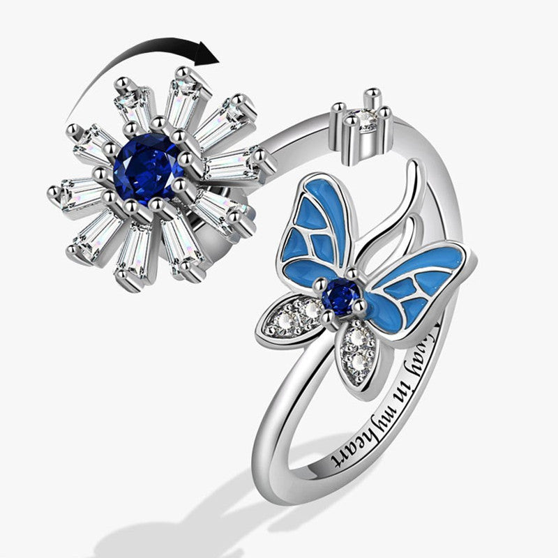 Anillo mariposa y flor azul